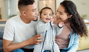 Shot of a young family bonding with their baby boy at home Home Security 101: How to Protect Your Home